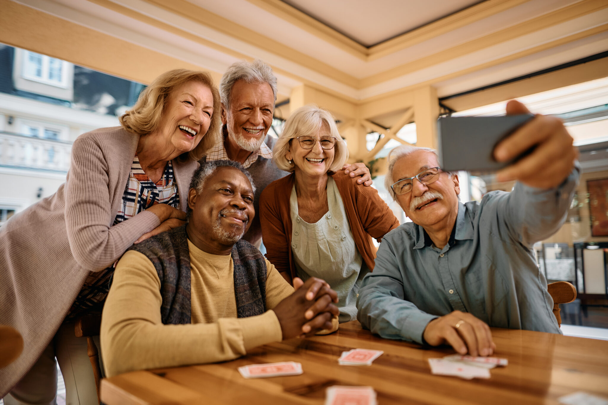 a group of older adults taking a selfie