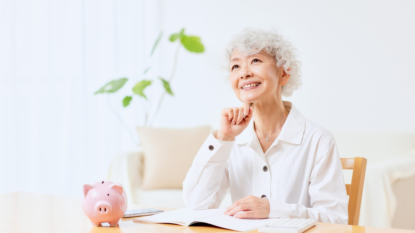 Blog Images – 2025-07-29T073450.417 Senior woman thinking happily about finances