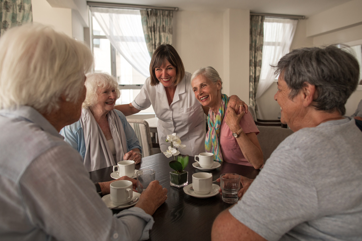 Shot of a group of senior people having coffee together at a retirement home
