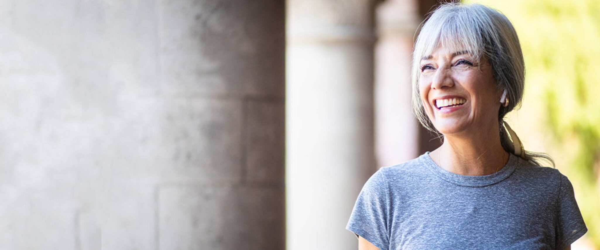 senior woman enjoys the outdoors and smiles