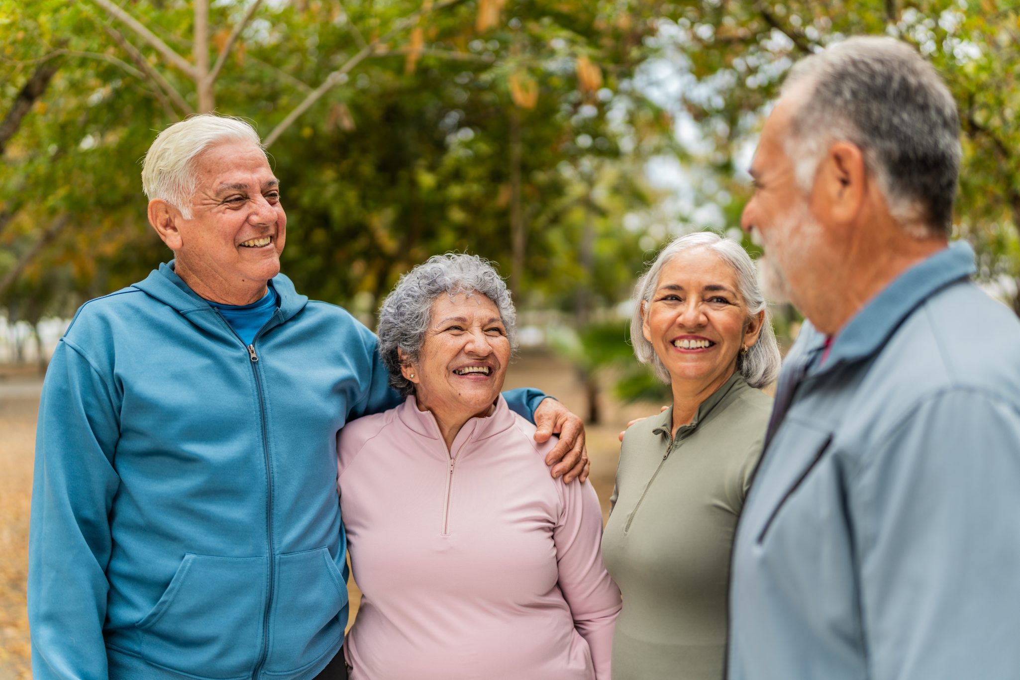 Group of senior friends smiling together at park